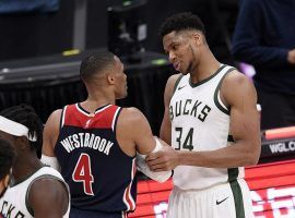 Russell Westbrook and Greek Freak have a post-game chat after both players scored a triple-double when the Milwaukee Bucks defeated the Washington Wizards. (Image: Nick Wass/AP)