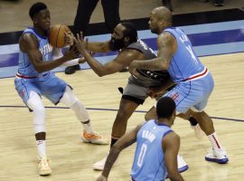 James Harden from the Brooklyn Nets gets triple-teamed by the Rockets during his return to Houston, in which he posted another triple-double. (Image: Bob Levey/AP)