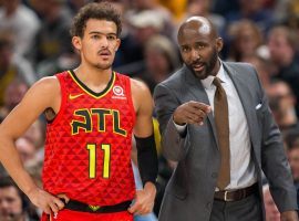 Lloyd Pierce advises Trae Young during an Atlanta Hawks game last season. (Image: Dan Feldman/Getty)