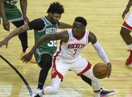 Houston Rockets guard Victor Oladipo dribbles through a trap by the Boston Celtics. (Image: Troy Taormina/AP)