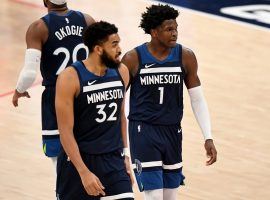 Karl-Anthony Towns and rookie Anthony Edwards of the Minnesota Timberwolves discuss strategy in a recent game during their losing streak. (Image: Will Newton/Getty)