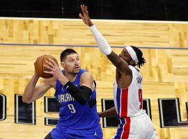 Nikola Vucevic of the Orlando Magic, seen here defended by Detroit Pistons forward Jerami Grant. The Boston Celtics are considering a trade for either Grant or Vucevic. (Image: Joe Skipper/AP)