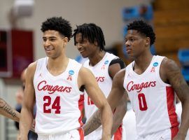 Quentin Grimes (24), the top scorer for the Houston Cougars, celebrates a victory with teammates Marcus Sasser (0). (Image: Ben Solomon/Getty)