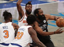 James Harden of the Brooklyn Nets, seen here being swarmed by the New York Knicks, will miss at least 10 days with a hamstring injury. (Image: Al Bello/Getty)