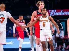 Knicks center Taj Gibson (67) celebrates a victory over the Washington Wizards with rookie Immanuel Quickley. (Image: Getty)