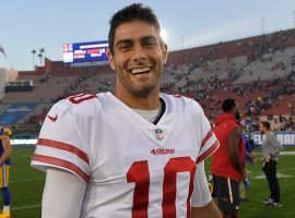 San Francisco 49ers quarterback Jimmy Garoppolo celebrates a victory over the LA Rams. Jimmy G is mentioned in the latest batch of NFL trade rumors with the 2021 NFL Draft rapidly approaching. (Image: Mark J. Terrill/AP)