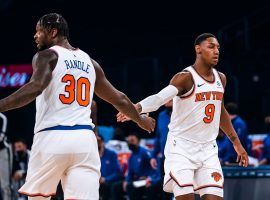 Julius Randle and RJ Barrett of the New York Knicks slap hands after Randle knocked down a 3-pointer against the New Orleans Pelicans. (Image: Getty)