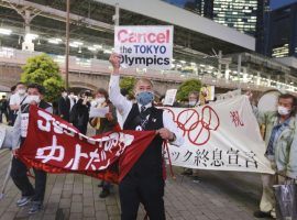 Demonstrators protest against holding the Tokyo Summer Olympics this summer during a May 17, 2021 rally. (Image: Koji Sasahara/AP)