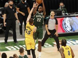 Khris Middle of the Milwaukee Bucks pulls up for a game-winning shot in overtime to edge out the Miami Heat in Game 1 of their first-round series in the NBA playoffs. (Image: Jeff Hanisch/USA Today Sports)