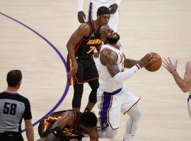 LeBron James, seen here screaming in agony when he rolled his ankle against the Atlanta Hawks in late March, missed 24 games with the LA Lakers while recovering from the injury. (Image: Marcio Jose Sanchez/Getty)