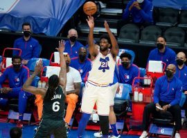 Philadelphia 76ers center Joel Embiid shoots a jumper over Brooklyn Nets center DeAndre Jordan during a battle between Atlantic Division rivals and two teams fighting for the #1 seed in the Eastern Conference playoffs. (Image: Porter Lambert/Getty)