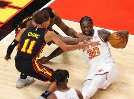 Trae Young of the Atlanta Hawks swarms Julius Randle from the New York Knicks during a game earlier in the season in Atlanta. (Image: Kevin C. Cox/Getty)