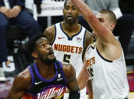 Deandre Ayton of the Phoenix Suns attempts a shot against Nikola Jokic from the Denver Nuggets in an early-season meeting in January. (Image: USA Today Sports)