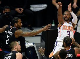 Chris Paul from the Phoenix Suns attempts a 3-pointer against Kawhi Leonard (2) and the LA Clippers earlier in the regular season. (Image: Getty)