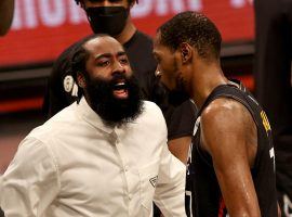 James Harden of the Nets, in street clothes, cheers on teammate Kevin Durant during a blowout win over the Milwaukee Bucks in Game 2 at the Barclays Center in Brooklyn. (Image: Georgia Corrigan/Getty)
