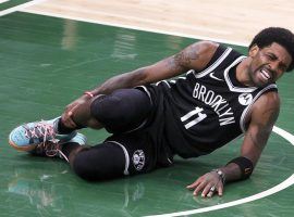 Brooklyn Nets guard Kyrie Irving grimaces in pain with an ankle injury during the second quarter of Game 4 of the Eastern Conference Semifinals against the Milwaukee Bucks at Fiserv Forum. (Image: Getty)