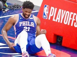 Joel Embiid of the Philadelphia 76ers grimaces after suffering an injury in Game 4 against the Washington Wizards at the Capital One Arena in downtown Washington, DC. (Image: Getty)