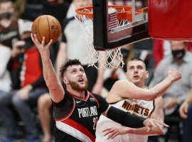 Jusuf Nurkic of the Portland Trail Blazers scoops a layup against Nikola Jokic of the Denver Nuggets in Game 4 at the Moda Center in Portland. (Image: Steph Chambers/Getty)