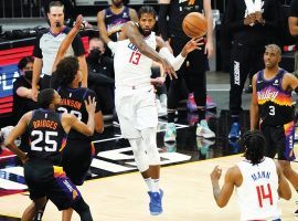 LA Clippers guard Paul George aka Playoff P passes the ball to a teammate on the perimeter of Game 5 against the Phoenix Suns in the Western Conference Finals. (Image: Matt York/AP)