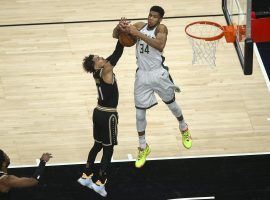 Trae Young of the Atlanta Hawks has his shot blocked by the Greek Freak from the Milwaukee Bucks during a regular-season meeting between the two Eastern Conference Finals finalists. (Image: Suzanne Greenberg/USA Today Sports)