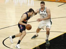 Brook Lopez (11) from the Milwaukee Bucks defends Dario Saric of the Phoenix Suns moments before Saric suffers a serious knee injury that derailed the rest of the postseason. (Image: Getty)