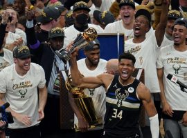 Giannis 'Greek Freak' Antetokounmpo celebrates winning his first championship with the Milwaukee Bucks and their first title since 1971. (Image: Paul Sancya/AP)