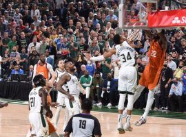 Giannis 'Greek Freak' Antetokounmpo of the Milwaukee Bucks prevents a potential dunk from Deandre Ayton of the Phoenix Suns in Game 4 of the 2021 NBA Finals. (Image: Getty)