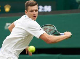 Hubert Hurkacz upset Daniil Medvedev in five sets to set up a Tuesday quarterfinals showdown with Roger Federer at Wimbledon. (Image: Peter van den Berg/USA Today Sports)