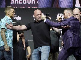 Conor McGregor (right) and Dustin Poirier (left) will meet up for their third fight when they clash in the main event of UFC 264. (Image: John Locher/AP)