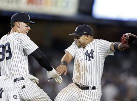 Aaron Judge and Andrew Velasquez from the New York Yankees celebrate a sweep of the Boston Red Sox at Yankee Stadium in the Bronx. (Image: Adam Hunger/Getty)