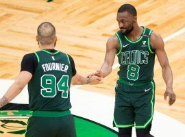 Kemba Walker (8) and Evan Fournier (94) slap hands during a game for the Boston Celtics last season. (Image: Getty)