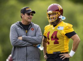 Head coach Ron Rivera and quarterback Ryan Fitzpatrick chat during training camp for the Washington Football Team. (Image: Scott Taetsch/Getty)