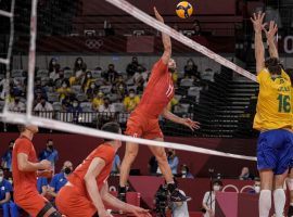 The ROC came from behind to beat Brazil and reach the menâ€™s volleyball gold medal match, where it will face France. (Image: Manu Fernandez/AP)