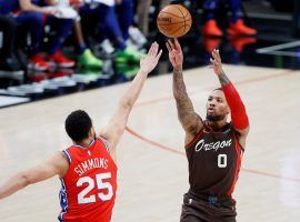 Damian Lillard from the Portland Trail Blazers shoots a deep 3-pointer over Ben Simmons of the Philadelphia 76ers, but the two All-Stars are the subject of trade rumors. (Image: Getty)