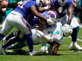Buffalo Bills defenders smush Miami Dolphins quarterback Tua Tagovailoa in the first quarter of Week 2 at Hard Rock Stadium. (Image: Getty)