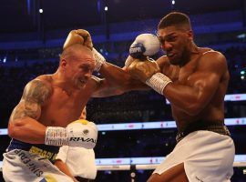 Oleksandr Usyk (left) outboxed Anthony Joshua (right) to win three of the major heavyweight boxing world titles on Saturday. (Image: Mark Robinson/Matchroom Boxing)
