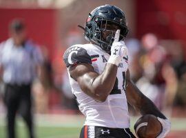 The Cincinnati Bearcats are seeking a victory that can vault them into the playoff conversation when they face Notre Dame on Saturday. (Image: Marc Lebryk/USA Today Sports)