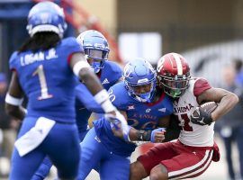 Oklahoma comes from behind to beat Kansas on Saturday, doing enough to keep their national championship hopes alive. (Image: Ian Maule/Tulsa World)