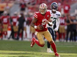 Rookie quarterback Trey Lance scrambles against the Seattle Seahawks in Week 4 after Jimmy G went down with an injury. (Image: Ezra Shaw/Getty)