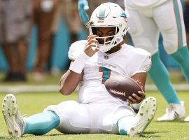 Miami Dolphins quarterback Tua Tagovailoa gathers himself after the porous offensive line allowed a sack. (Image: Getty)