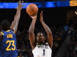 Anthony Edwards from the Minnesota Timberwolves shoots a 3-pointer over Draymond Green of the Golden State Warriors. (Image: Noah Graham/Getty)