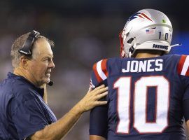 New England Patriots head coach Bill Belichick advises rookie quarterback Mac Jones. (Image: Mitchell Leff/Getty)