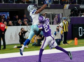 Dallas Cowboys WR Amari Cooper leaps for a touchdown catch in the end zone against Minnesota Vikings CB Cameron Dantzler. (Image: Jim Mone/AP)