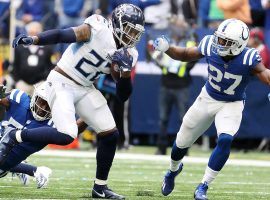 Tennessee Titans running back Derrick Henry evades a tackler from the Indianapolis Colts moments before he suffers a season-ending foot injury. (Image: AP)