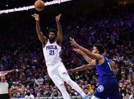 Joel Embiid from the Philadelphia 76ers passes when the Minnesota Timberwolves attempt to double team him. (INSERT: Getty)
