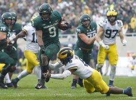 Michigan State defeated Michigan on Saturday to remain undefeated, though the Spartans remain an outsider in the national championship odds picture. (Image: Raj Mehta/USA Today Sports)