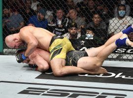 Glover Teixeira (top) became the oldest UFC first-time champion in history by beating Jan Blachowicz at UFC 267 on Saturday. (Image: Chris Unger/Zuffa)