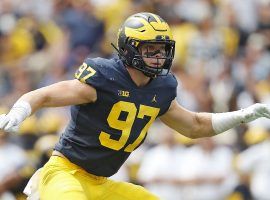 Aidan Hutchinson and the Michigan Wolverines will take on the Georgia Bulldogs in the Orange Bowl, the second CFP semifinal. (Image: Mike Mulholland/MLive.com)