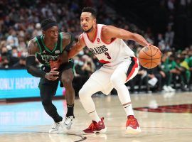 Portland Trail Blazers guard CJ McCollum attempts to drive to the hoop against Dennis Schroder from the Boston Celtics. (Image: Abbie Parr/Getty)