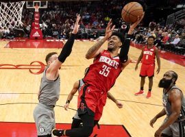 Christian Wood from the Houston Rockets drives to the basket against the Brooklyn Nets, while James Harden looks on. (Image: Porter Lambert/Getty)